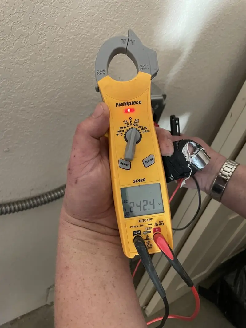 Voltage testing with clamp meter during Generator Installation in Chadds Ford